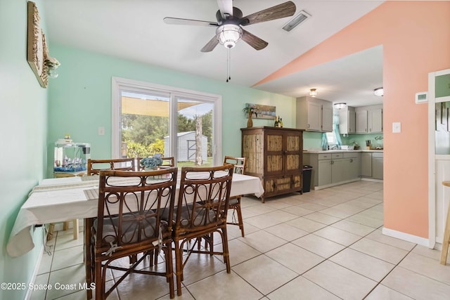 542 Troy Rd SW, Palm Bay, FL 32908 - dining space with lofted ceiling, a ceiling fan, and light tile patterned floors