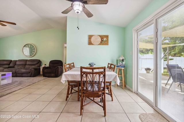542 Troy Rd SW, Palm Bay, FL 32908 - dining room with ceiling fan, vaulted ceiling, and light tile patterned floors