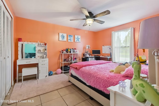 542 Troy Rd SW, Palm Bay, FL 32908 - bedroom with tile patterned flooring, a closet, and ceiling fan