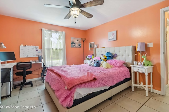 542 Troy Rd SW, Palm Bay, FL 32908 - tiled bedroom with an office area and ceiling fan