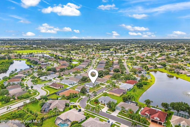 1493 Laramie Cir, Melbourne, FL 32940 - aerial perspective of suburban area with a nearby body of water