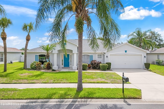 1493 Laramie Cir, Melbourne, FL 32940 - single story home featuring stucco siding, concrete driveway, an attached garage, a front yard, and a shingled roof