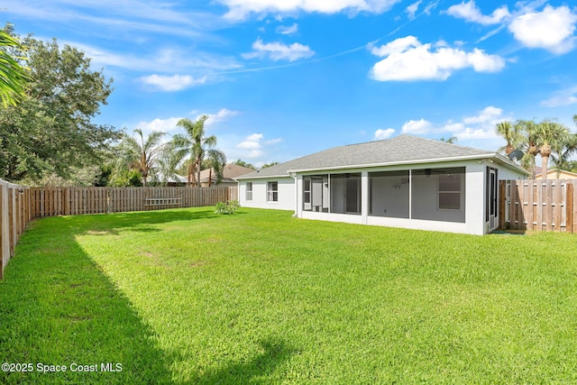 1493 Laramie Cir, Melbourne, FL 32940 - fenced backyard featuring a sunroom and a ceiling fan