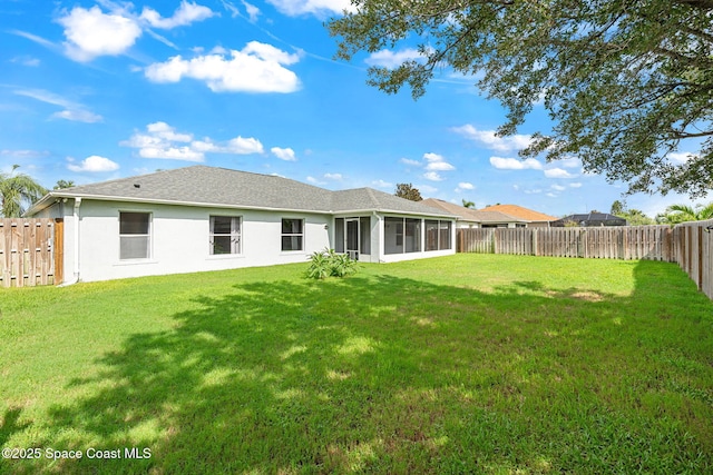 1493 Laramie Cir, Melbourne, FL 32940 - back of house with a sunroom, a fenced backyard, and stucco siding