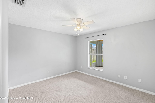 1493 Laramie Cir, Melbourne, FL 32940 - empty room with ceiling fan, carpet flooring, and a textured ceiling