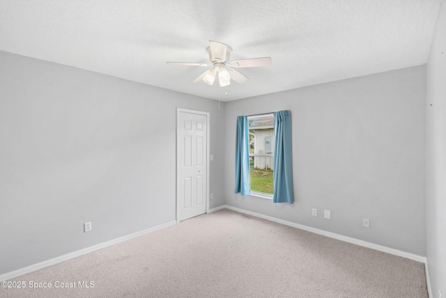 1493 Laramie Cir, Melbourne, FL 32940 - carpeted empty room featuring a ceiling fan and a textured ceiling