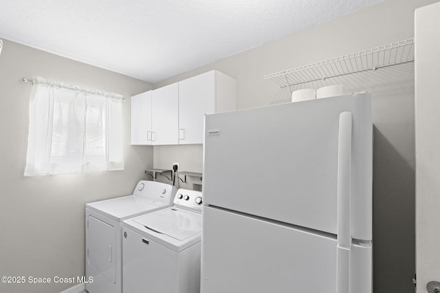 1493 Laramie Cir, Melbourne, FL 32940 - laundry area featuring washer and clothes dryer and cabinet space