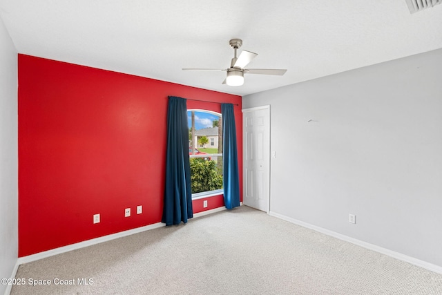 1493 Laramie Cir, Melbourne, FL 32940 - empty room featuring a ceiling fan and carpet flooring