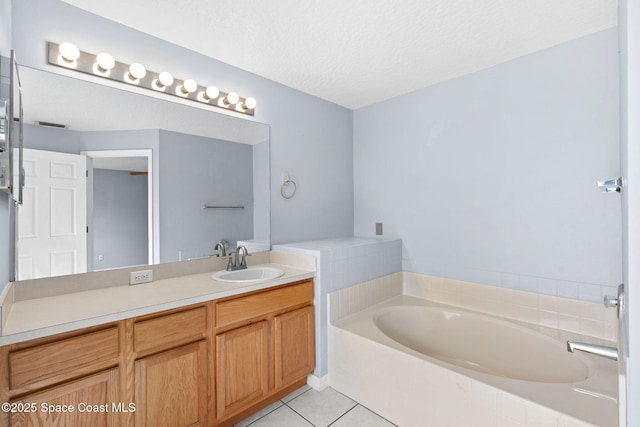 1493 Laramie Cir, Melbourne, FL 32940 - bathroom with a bath, vanity, tile patterned flooring, and a textured ceiling