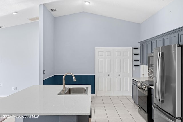 1493 Laramie Cir, Melbourne, FL 32940 - kitchen featuring stainless steel appliances, light countertops, vaulted ceiling, light tile patterned floors, and open shelves