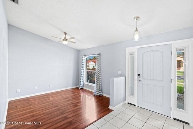 1493 Laramie Cir, Melbourne, FL 32940 - entrance foyer featuring a ceiling fan and light wood finished floors
