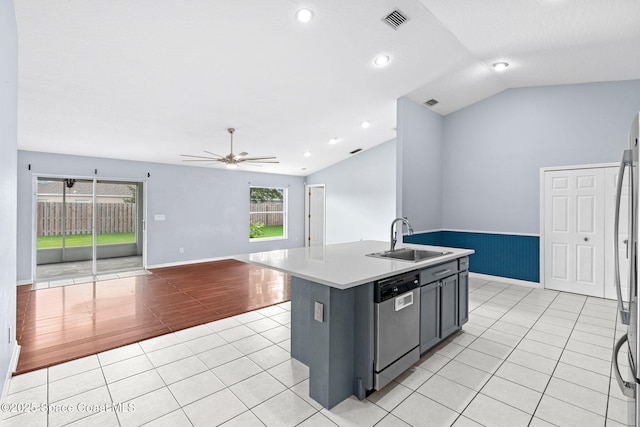 1493 Laramie Cir, Melbourne, FL 32940 - kitchen featuring dishwasher, vaulted ceiling, light tile patterned floors, ceiling fan, and light countertops
