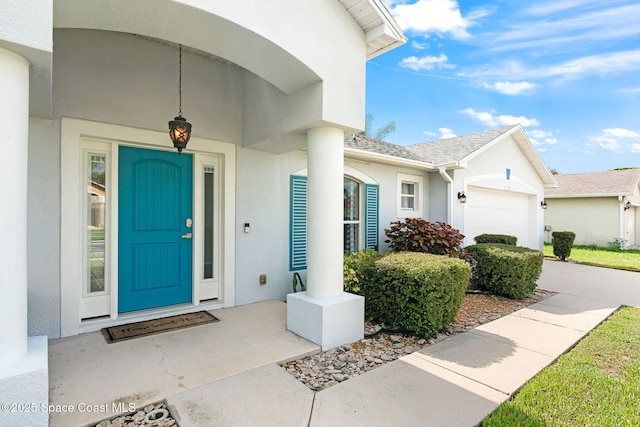 1493 Laramie Cir, Melbourne, FL 32940 - property entrance with stucco siding and a garage