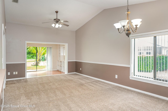 386 Myrtlewood Rd, Melbourne, FL 32940 - carpeted empty room with a chandelier, vaulted ceiling, and a ceiling fan