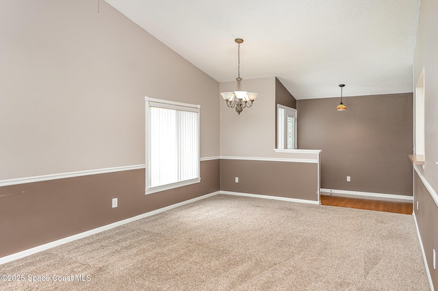 386 Myrtlewood Rd, Melbourne, FL 32940 - unfurnished room with vaulted ceiling, carpet flooring, and a chandelier
