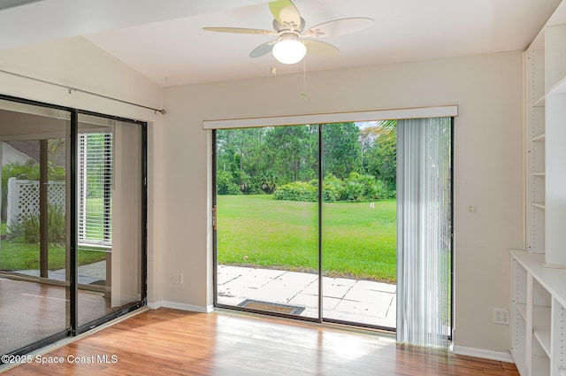 386 Myrtlewood Rd, Melbourne, FL 32940 - doorway featuring light wood-type flooring, a ceiling fan, and vaulted ceiling