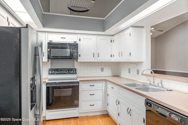 386 Myrtlewood Rd, Melbourne, FL 32940 - kitchen with stainless steel fridge, white electric range oven, dishwasher, black microwave, and decorative backsplash