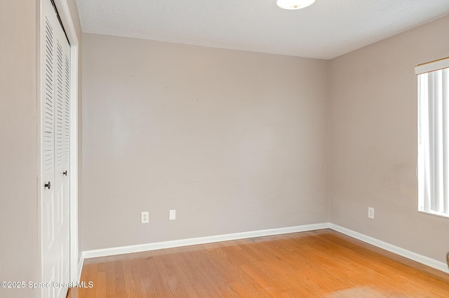 386 Myrtlewood Rd, Melbourne, FL 32940 - unfurnished bedroom with light wood-style floors and a closet