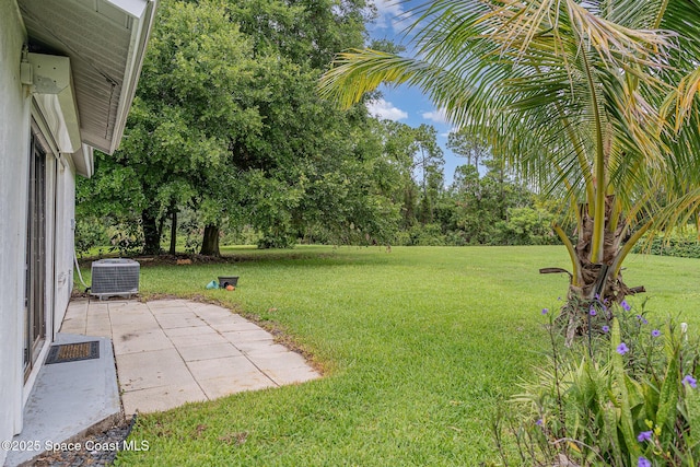 386 Myrtlewood Rd, Melbourne, FL 32940 - view of grassy yard featuring a patio