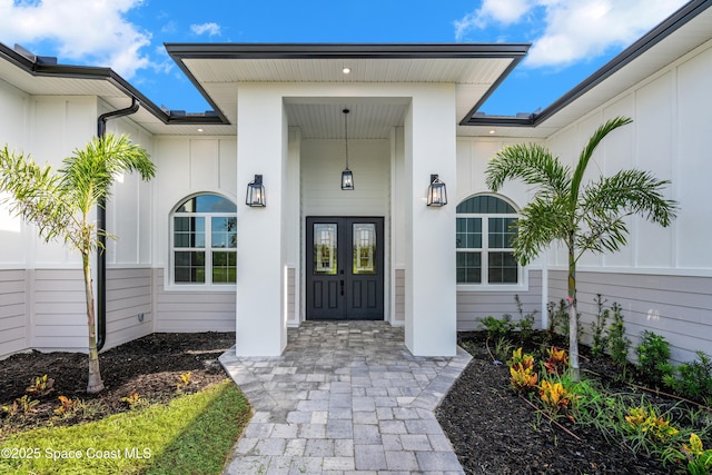 278 Stallion St, Palm Bay, FL 32909 - doorway to property featuring board and batten siding