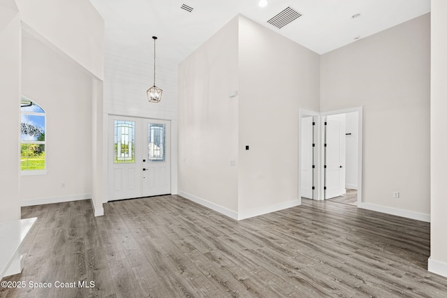 278 Stallion St, Palm Bay, FL 32909 - foyer entrance with a high ceiling, wood finished floors, and a chandelier