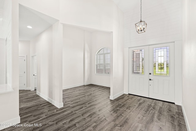 278 Stallion St, Palm Bay, FL 32909 - foyer entrance with a high ceiling, a chandelier, and dark wood finished floors