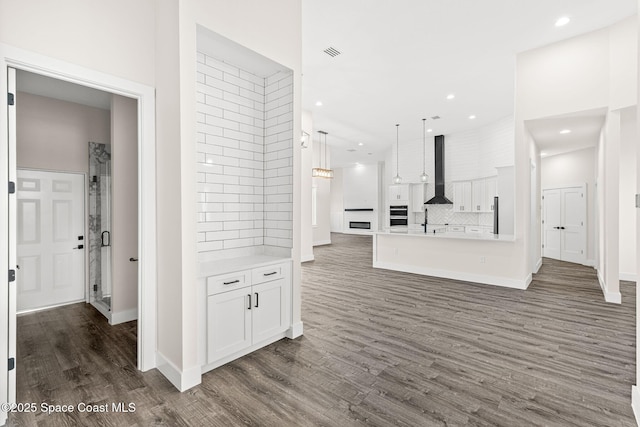 278 Stallion St, Palm Bay, FL 32909 - unfurnished living room with wood finished floors and recessed lighting