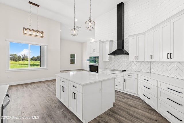 278 Stallion St, Palm Bay, FL 32909 - kitchen with wall chimney exhaust hood, black appliances, tasteful backsplash, a center island, and light countertops