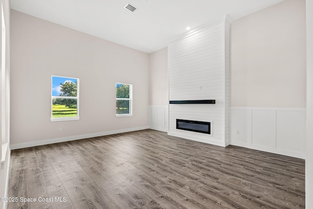 278 Stallion St, Palm Bay, FL 32909 - unfurnished living room featuring wood finished floors and a fireplace