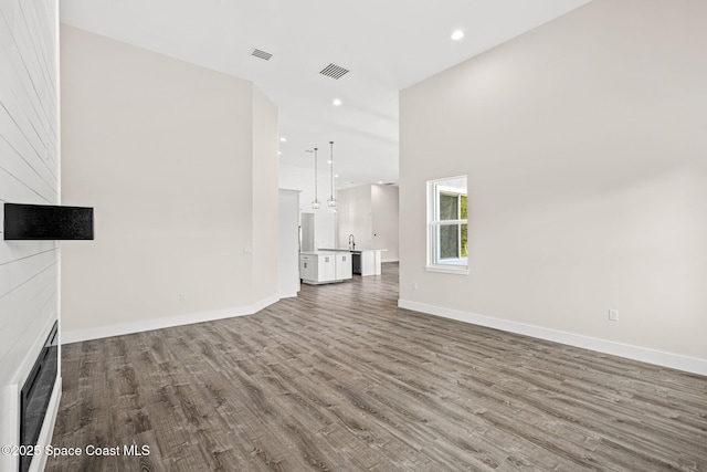 278 Stallion St, Palm Bay, FL 32909 - unfurnished living room featuring wood finished floors and recessed lighting