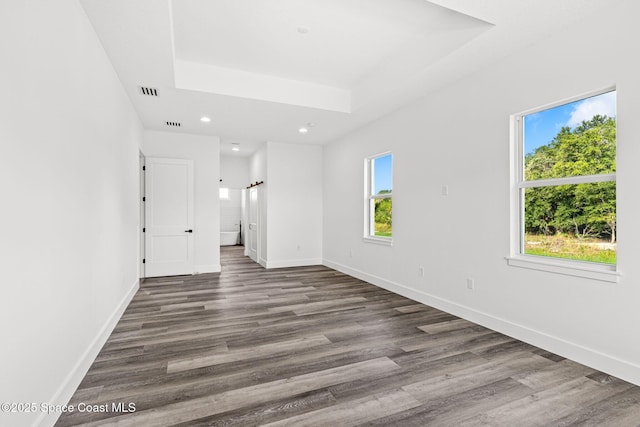 278 Stallion St, Palm Bay, FL 32909 - empty room with recessed lighting, dark wood-style floors, and a raised ceiling