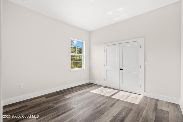 278 Stallion St, Palm Bay, FL 32909 - unfurnished bedroom featuring baseboards and wood finished floors