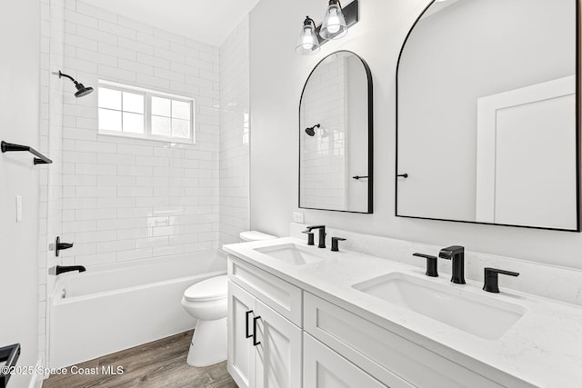 278 Stallion St, Palm Bay, FL 32909 - full bathroom with wood finished floors, double vanity, and shower / bath combination