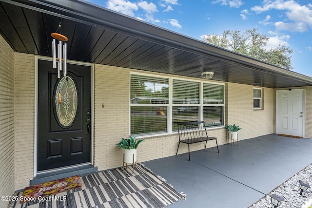 560 Conifer St, Melbourne, FL 32904 - entrance to property featuring brick siding