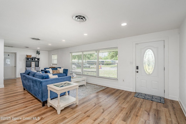 560 Conifer St, Melbourne, FL 32904 - living room with light wood finished floors and recessed lighting