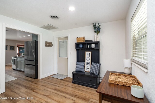 560 Conifer St, Melbourne, FL 32904 - living room featuring light wood-style floors and baseboards