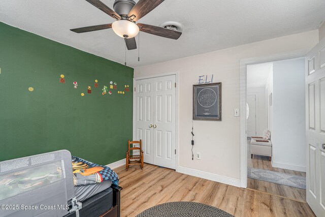560 Conifer St, Melbourne, FL 32904 - bedroom featuring wood finished floors, a closet, and a ceiling fan