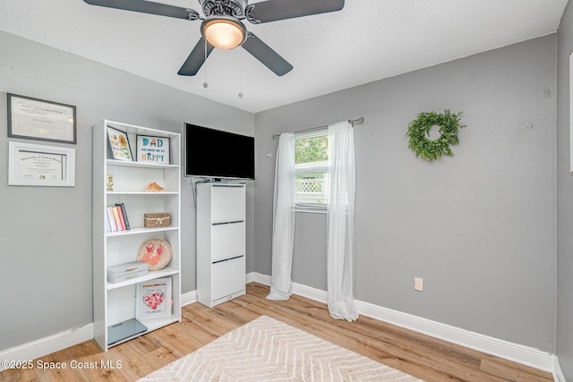 560 Conifer St, Melbourne, FL 32904 - bedroom with light wood finished floors and ceiling fan
