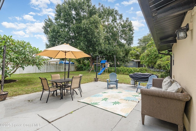 560 Conifer St, Melbourne, FL 32904 - view of patio / terrace featuring a playground and outdoor dining space