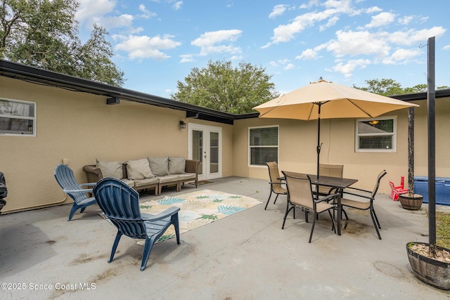 560 Conifer St, Melbourne, FL 32904 - view of patio / terrace with outdoor lounge area, french doors, and outdoor dining space