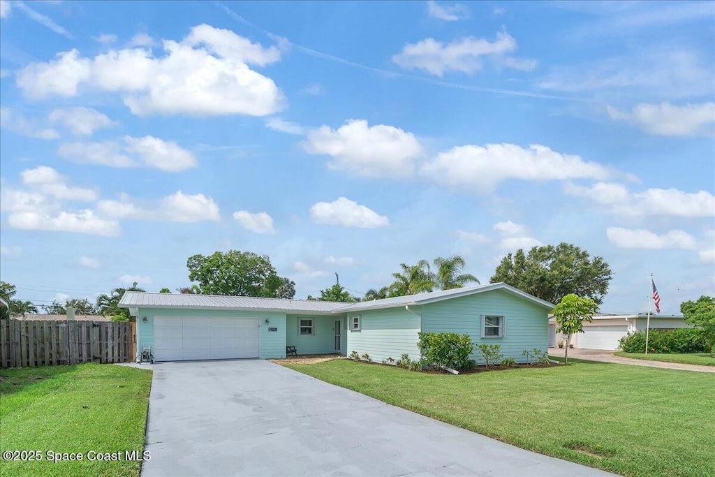 221 Timpoochee Dr, Indian Harbour Beach, FL 32937 - single story home with driveway and a garage