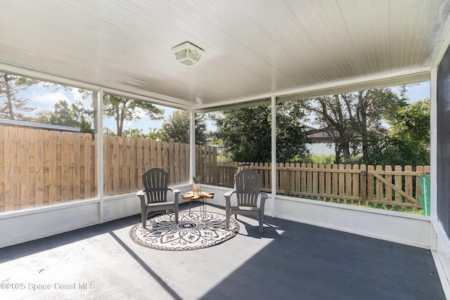 1519 Bronco Dr, Melbourne, FL 32940 - sunroom / solarium featuring an outdoor fire pit and plenty of natural light