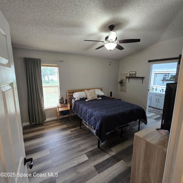 1519 Bronco Dr, Melbourne, FL 32940 - bedroom featuring wood finished floors, a textured ceiling, and a ceiling fan