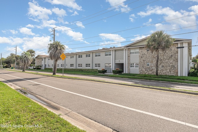 5600 N Banana River Blvd Unit 14, Cocoa Beach, FL 32931 - view of asphalt street with curbs, traffic signs, and sidewalks