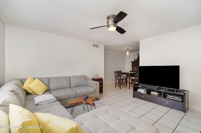 5600 N Banana River Blvd Unit 14, Cocoa Beach, FL 32931 - living area featuring a ceiling fan and light tile patterned floors