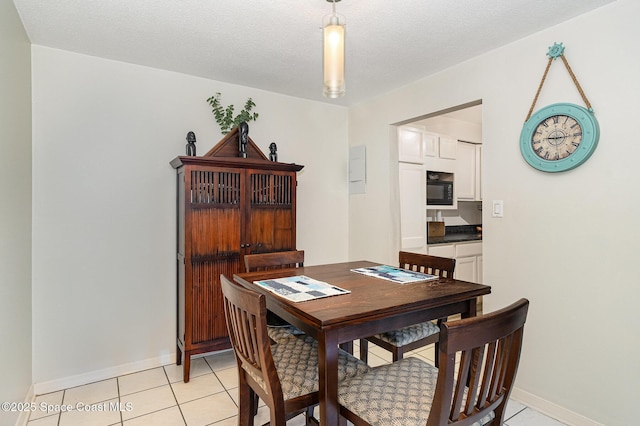 5600 N Banana River Blvd Unit 14, Cocoa Beach, FL 32931 - dining area featuring light tile patterned floors