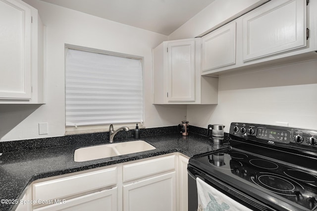 5600 N Banana River Blvd Unit 14, Cocoa Beach, FL 32931 - kitchen featuring black electric range and white cabinets