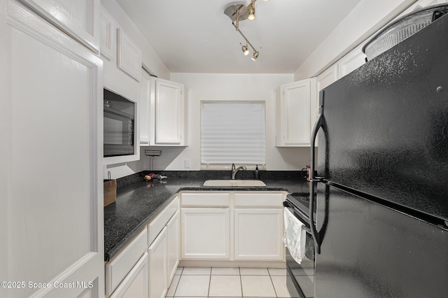 5600 N Banana River Blvd Unit 14, Cocoa Beach, FL 32931 - kitchen featuring black appliances, white cabinets, and light tile patterned flooring