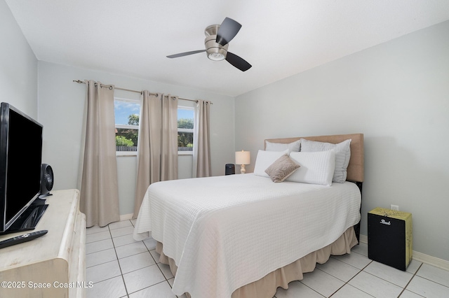 5600 N Banana River Blvd Unit 14, Cocoa Beach, FL 32931 - bedroom featuring light tile patterned flooring and a ceiling fan