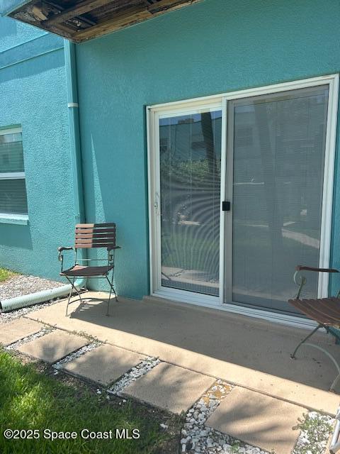 351 Taylor Ave Unit E5, Cape Canaveral, FL 32920 - view of exterior entry with stucco siding